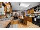 Kitchen features wood cabinets, wood flooring, and a breakfast nook at 4120 Statesville Blvd, Salisbury, NC 28147