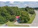 Ranch home with red roof nestled in a wooded area at 4120 Statesville Blvd, Salisbury, NC 28147