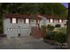 Ranch-style home with a red roof and attached garage at 4120 Statesville Blvd, Salisbury, NC 28147