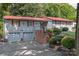 Gray house with red accents, two-car garage, and brick steps leading to the entrance at 4120 Statesville Blvd, Salisbury, NC 28147