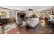 Bright living room featuring hardwood floors, ample seating, and a ceiling fan at 4120 Statesville Blvd, Salisbury, NC 28147