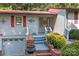 Gray house with red accents, a covered porch, and a brick walkway at 4120 Statesville Blvd, Salisbury, NC 28147