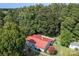 Large ranch home with red metal roof and fenced backyard at 4120 Statesville Blvd, Salisbury, NC 28147