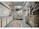 Basement laundry area with washer, dryer, and storage at 4120 Statesville Blvd, Salisbury, NC 28147
