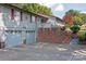 Gray house with a double-car garage, brick retaining wall and steps leading to the entrance at 4120 Statesville Blvd, Salisbury, NC 28147