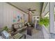 Covered porch with wicker furniture and ceiling fan at 4120 Statesville Blvd, Salisbury, NC 28147