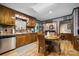 This kitchen boasts wood cabinets, a breakfast nook, and wood flooring at 4120 Statesville Blvd, Salisbury, NC 28147