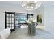 Elegant dining room with a round table and barn doors at 4814 Reason Ct # 66, Harrisburg, NC 28075