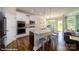 Bright kitchen with granite island, stainless steel appliances, and backyard access at 119 Saidin Ln, Troutman, NC 28166