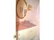 Pink vanity with a sink and gold framed mirror at 718 Ferndale Dr, Statesville, NC 28677