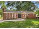 Brick ranch house with a double front door and well-manicured lawn at 1573 Timberlake Dr, Shelby, NC 28150