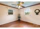 Well-lit bedroom with hardwood floors and two windows at 1573 Timberlake Dr, Shelby, NC 28150