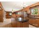Kitchen boasts granite countertops and wood cabinets at 1573 Timberlake Dr, Shelby, NC 28150