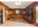 Sunroom with built-in shelving, tile floor and access to deck at 1573 Timberlake Dr, Shelby, NC 28150
