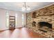 Finished basement featuring a brick fireplace and wood shelving at 1573 Timberlake Dr, Shelby, NC 28150