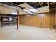 Unfinished basement with shelving unit and storage space at 1573 Timberlake Dr, Shelby, NC 28150