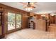 Sunroom with backyard access and a ceiling fan at 1573 Timberlake Dr, Shelby, NC 28150
