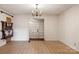 Bright dining room featuring tile floors and a chandelier at 1573 Timberlake Dr, Shelby, NC 28150