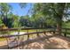 Deck with table and chairs, offering a view of the backyard at 1573 Timberlake Dr, Shelby, NC 28150