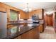 Kitchen with granite countertops, stainless steel appliances, and wood cabinets at 1573 Timberlake Dr, Shelby, NC 28150