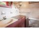 Clean bathroom with pink vanity and tiled walls at 1573 Timberlake Dr, Shelby, NC 28150