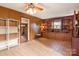 Sunroom with built-in shelving, tile floors, and a ceiling fan at 1573 Timberlake Dr, Shelby, NC 28150