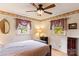 Cozy bedroom with ceiling fan, hardwood floors, and ample natural light at 1573 Timberlake Dr, Shelby, NC 28150
