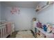 Adorable Bedroom featuring a crib, dresser, and plenty of storage at 1537 N Piedmont Ave, Kings Mountain, NC 28086