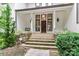 Front steps and entrance with stonework and plants at 3208 Sedgefield Rd, Statesville, NC 28625