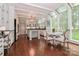 Modern kitchen with white cabinets, large island, and a breakfast nook at 3208 Sedgefield Rd, Statesville, NC 28625