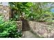 Stone pathway with lush landscaping and outdoor lighting at 3208 Sedgefield Rd, Statesville, NC 28625