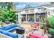 Relaxing patio features comfortable seating, fire pit, and built-in grill at 3208 Sedgefield Rd, Statesville, NC 28625