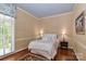 Bright bedroom with light walls and wood floors at 3208 Sedgefield Rd, Statesville, NC 28625