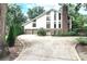 Two-story home with stone facade, attached garage, and circular driveway at 3208 Sedgefield Rd, Statesville, NC 28625
