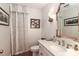 Elegant powder room with patterned wallpaper and gold accents at 3208 Sedgefield Rd, Statesville, NC 28625
