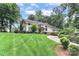 House with a large front yard, landscaping, and driveway at 3208 Sedgefield Rd, Statesville, NC 28625