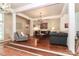 Elevated living room with hardwood floors, comfortable seating, and a chandelier at 3208 Sedgefield Rd, Statesville, NC 28625