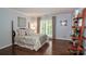 Guest bedroom with hardwood floors and window seat at 3208 Sedgefield Rd, Statesville, NC 28625