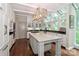 Modern kitchen with white cabinets, large island, and ample counter space at 3208 Sedgefield Rd, Statesville, NC 28625