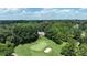 Aerial view of house on golf course with lush green surroundings at 3208 Sedgefield Rd, Statesville, NC 28625