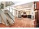 Open living room with hardwood floors, comfortable seating, and a view of the entryway at 3208 Sedgefield Rd, Statesville, NC 28625