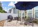 Relaxing patio featuring a table, chairs, umbrella, and lounge chair at 1446 Crest Creek Ct, Clover, SC 29710