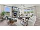 Spacious living room with stone fireplace and large windows at 315 Coronado Ave # 63, Matthews, NC 28104