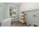 Laundry room with built-in cabinets and a window at 3029 River Rd, Shelby, NC 28152