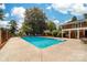 Inviting pool with brick patio and lounge chairs at 3029 River Rd, Shelby, NC 28152