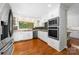 Modern kitchen with white cabinets and stainless steel appliances at 3029 River Rd, Shelby, NC 28152