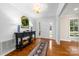 Bright entryway with hardwood floors and console table at 3029 River Rd, Shelby, NC 28152
