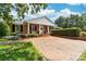 Ranch home with brick facade, landscaping, and brick driveway at 3029 River Rd, Shelby, NC 28152