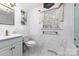 Clean bathroom with marble tile, a vanity with a sink, and a window at 3029 River Rd, Shelby, NC 28152
