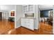 Convenient wet bar with white cabinets and a granite countertop at 3029 River Rd, Shelby, NC 28152